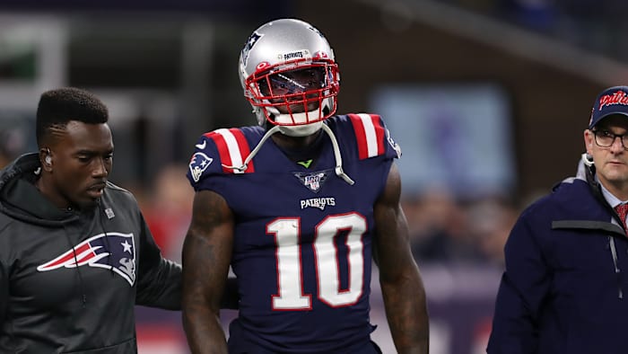 Patriots WR Josh Gordon walks off the field after suffering a knee injury against the Giants.